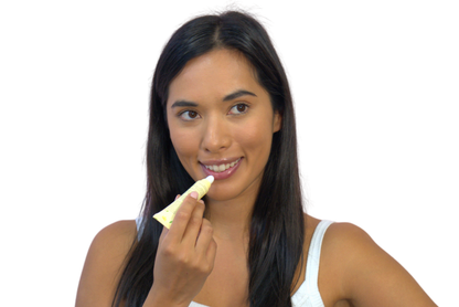 girl applying arnica lip mask