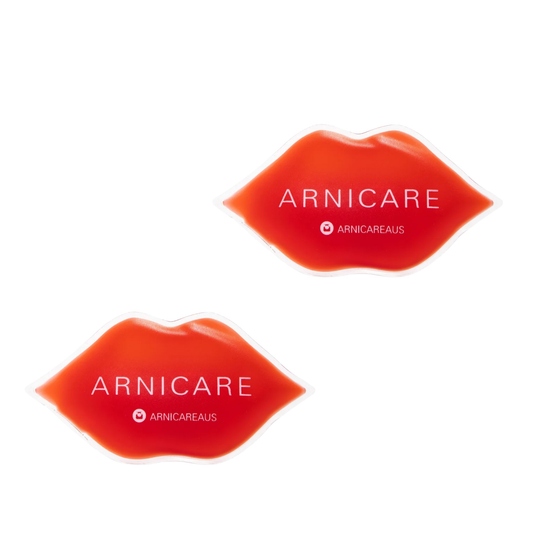 Two red lip-shaped cosmetic lip shape ice packs with white ARNICARE and ARNICAREAus branding, shown on a plain white background.